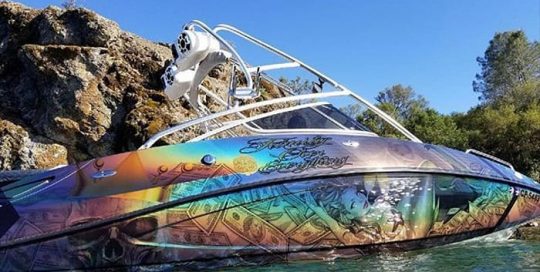 Boat Wrap wrapped in ColorFlip Gloss Psychedelic shade shifting vinyl and Avery DOL 6460 Gloss overlaminate