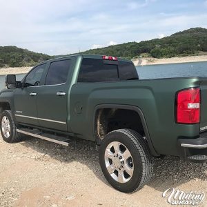 GMC Sierra wrapped in Matte Pine Green Metallic vinyl