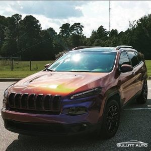 Jeep Cherokee wrapped in Avery ColorFlow Gloss Roaring Thunder Blue/Red shade shifting vinyl