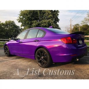 BMW 335I wrapped in Gloss Plum Explosion vinyl