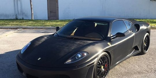 Ferrari F430 wrapped in Black Straight Carbon Fiber vinyl