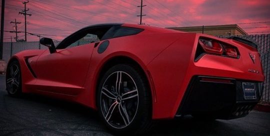 Chevrolet Corvette wrapped in Avery SW Satin Carmine Red vinyl