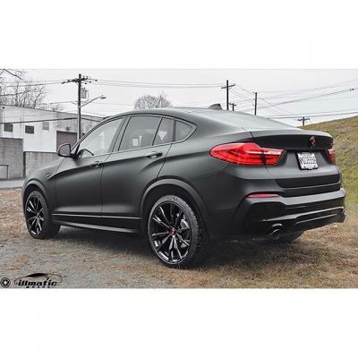 BMW X4 wrapped in Deep Matte Black vinyl