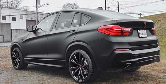 BMW X4 wrapped in Deep Matte Black vinyl