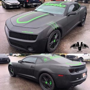 Chevrolet Camaro wrapped in Matte Black and Orafol 970RA Grass Green cut vinyl graphics
