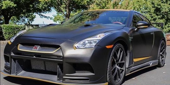 Nissan GTR wrapped in Satin Gold Dust Black and Brushed Gold vinyl