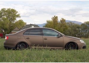 Volkswagen GLI wrapped in Matte Brown Metallic vinyl