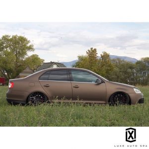 Volkswagen GLI wrapped in Matte Brown Metallic vinyl