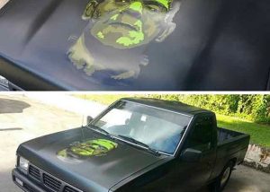 Nissan Pick Up Truck wrapped in Satin Black vinyl with custom printed Avery 1005 vinyl