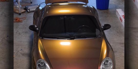 Porsche Cayman wrapped in Orafol Shift Effect Gloss Aubergine Bronze shade shifting vinyl