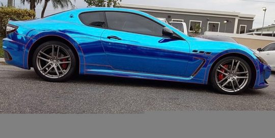 Maserati wrapped in Avery Blue Chrome and 1200 Orange Reflective vinyls