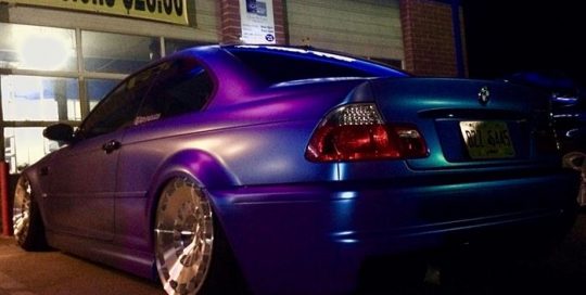 BMW M3 wrapped in ColorFlip Satin Glacier Frost Blue/Purple shade shifting vinyl