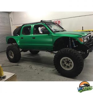 Toyota Tacoma wrapped in Satin Sheer Luck Green vinyl