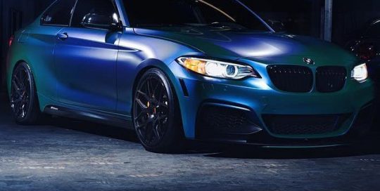 BMW 235I wrapped in Satin ColorFlip Caribbean Shimmer Cyan/Green shade shifting vinyl