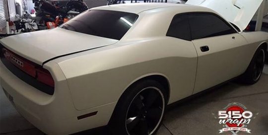 Dodge Challenger wrapped in Satin Pearl White vinyl