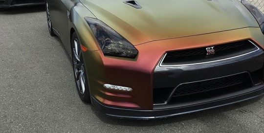 Nissan GTR wrapped in Avery ColorFlow Rising Sun Red/Gold shade shifting vinyl