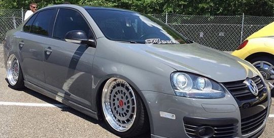 Volkswagen Jetta wrapped in Avery SW Gloss Dark Grey vinyl