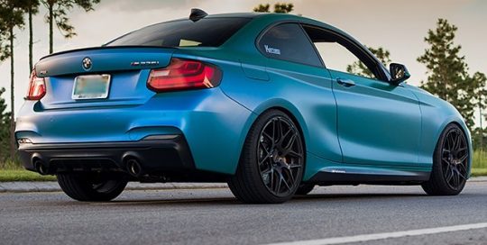 BMW 235 wrapped in Satin Flip Caribbean Shimmer Cyan/Green shade shifting vinyl