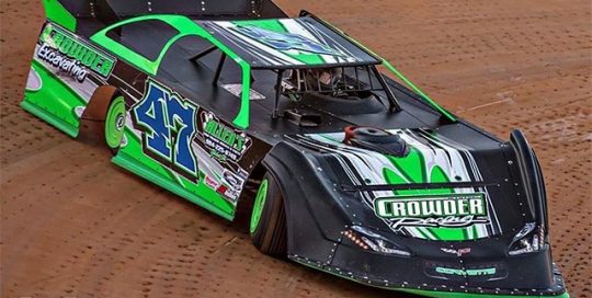 Car Raising wrapped in custom printed Orafol 3165RA and 6510 Fluorescent Green vinyls