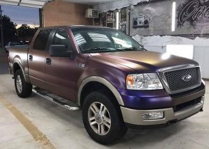 Ford F150 wrapped in Avery ColorFlow Satin Roaring Thunder Blue/Red shade shifting vinyl