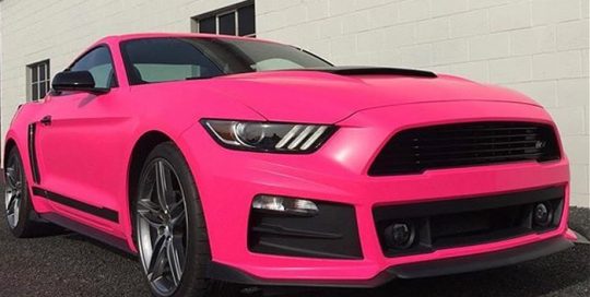 Ford Mustang wrapped in Neon Fluorescent Pink vinyl
