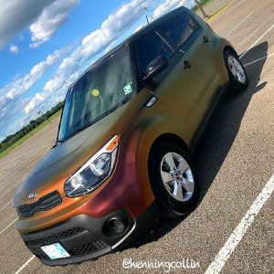 Kia Soul wrapped in Avery ColorFlow Satin Rising Sun Red/Gold shade shifting and Gloss Black vinyls