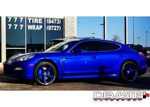 Porsche Panamera wrapped in Gloss Blue Raspberry vinyl