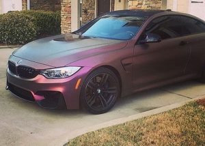 BMW M4 wrapped in Orafol 970RA Shift Effect Matte Aubergine/Bronze vinyl