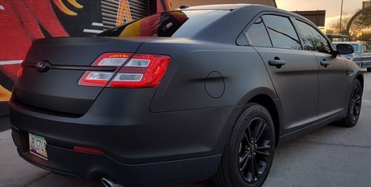 Ford Taurus wrapped in Matte Deep Black vinyl