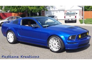 Mustang wrapped in Gloss Cosmic Blue vinyl
