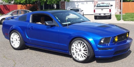 Mustang wrapped in Gloss Cosmic Blue vinyl