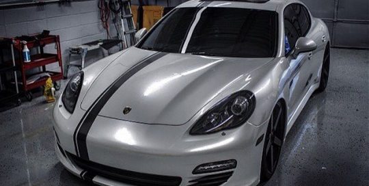 Porsche Panamera wrapped in Avery Gloss Pearl White vinyl