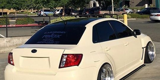 Subaru WRX wrapped in Gloss Light Ivory vinyl