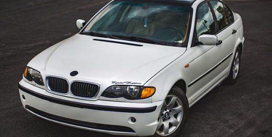BMW 325i wrapped in Avery SW Satin Pearl White vinyl