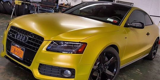 Audi A5 wrapped in Satin Bitter Yellow vinyl
