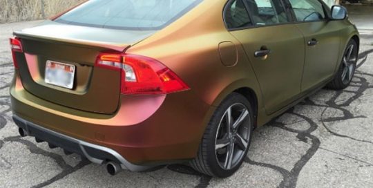 Volvo S-60-z wrapped in Avery Colorflow Rising Sun Satin Red/Gold Colorshift vinyl