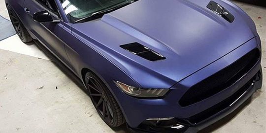 Ford Mustang wrapped in Avery Matte Night Blue Metallic vinyl