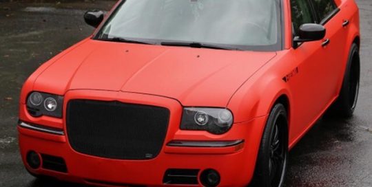 Chrysler 300 wrapped in Matte Red and Brushed Black vinyls