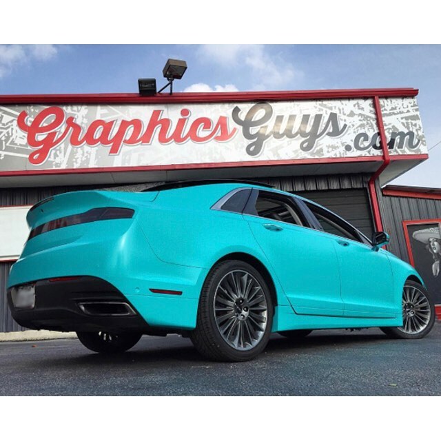 Lincoln MKS wrapped in Avery SW Satin Azure vinyl