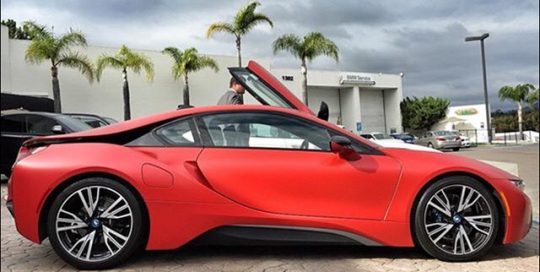 BMW I8 wrapped in Satin Smoldering Red vinyl