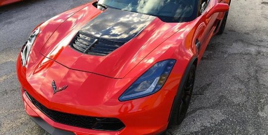 Chevy Corvette z06 wrapped in Avery SW Gloss Red vinyl