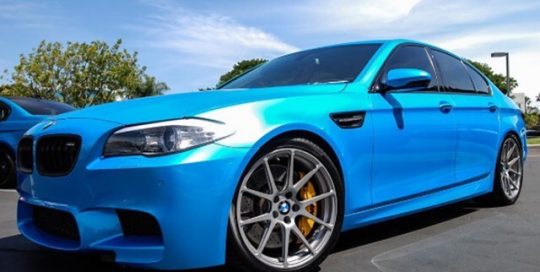 BMW M5 wrapped in Avery SW Bahama Blue Pearl vinyl