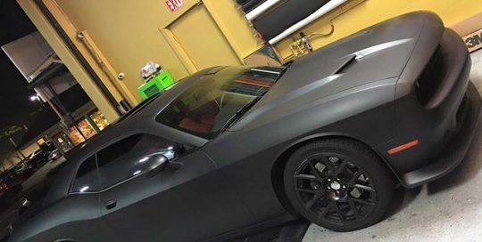 Dodge Challenger wrapped in Matte Deep Black vinyl