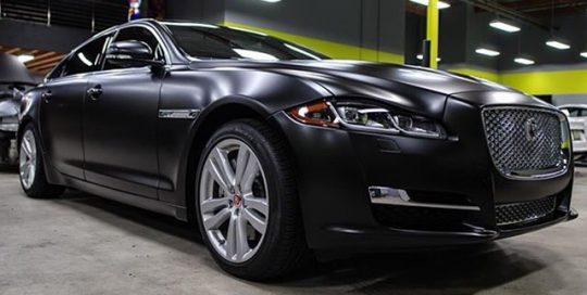 Jaguar XJL wrapped in Satin Black vinyl
