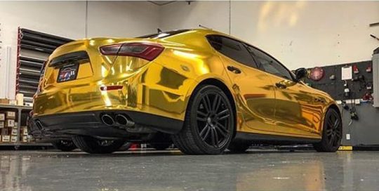 Maserati Ghibli wrapped in Avery SW Gold Chrome vinyl