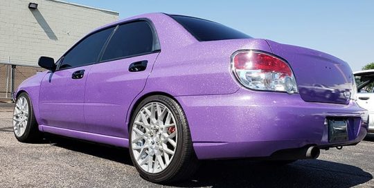 Subaru wrapped in Avery SW900 Gloss Diamond Purple vinyl