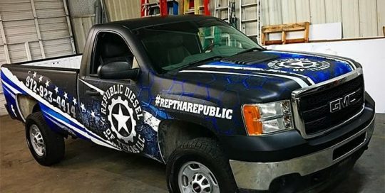 GMC wrapped in custom printed Avery 1105 vinyl with 1380z Matte overlaminate