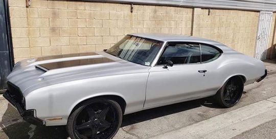 Cutlass wrapped in 3M 1080 Satin White Aluminum and Gloss Black vinyls