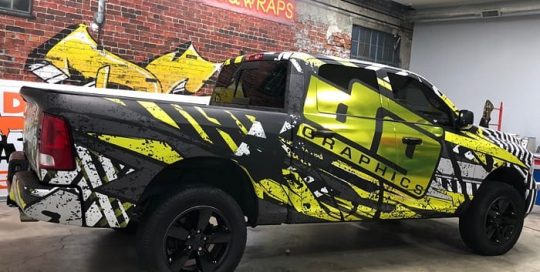 Dodge wrapped in custom printed Avery 1105ezrs vinyl with 1380z Matte overlaminate and Avery Silver Chrome laminated with Orafol 8300 Brimstone Yellow