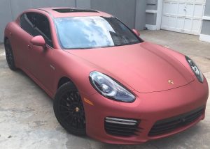 Porsche wrapped in Satin Red Aluminum vinyl